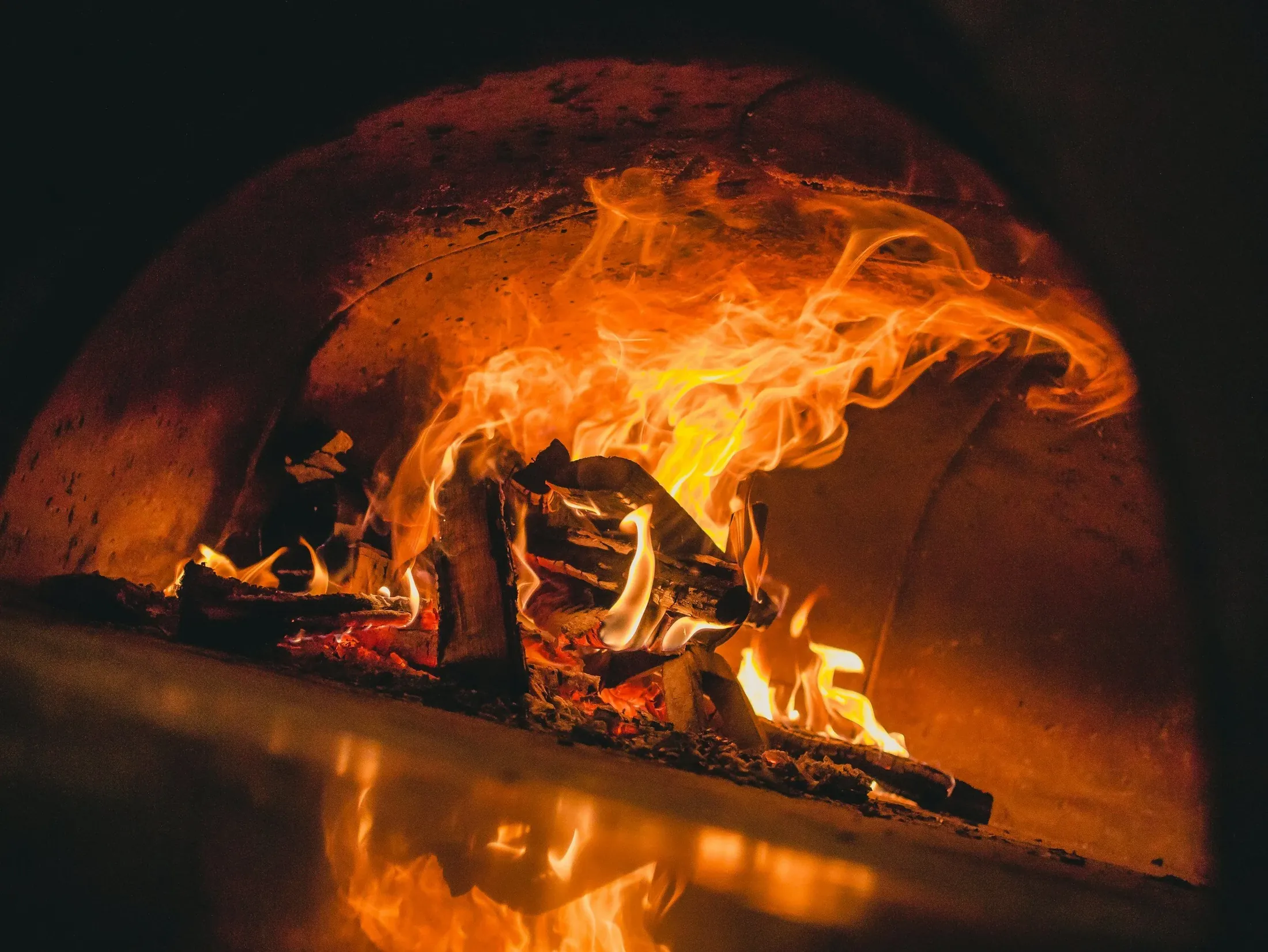Wood burning inside the Neapolitan oven